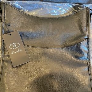 Brand new cross body bag with inter changeable straps